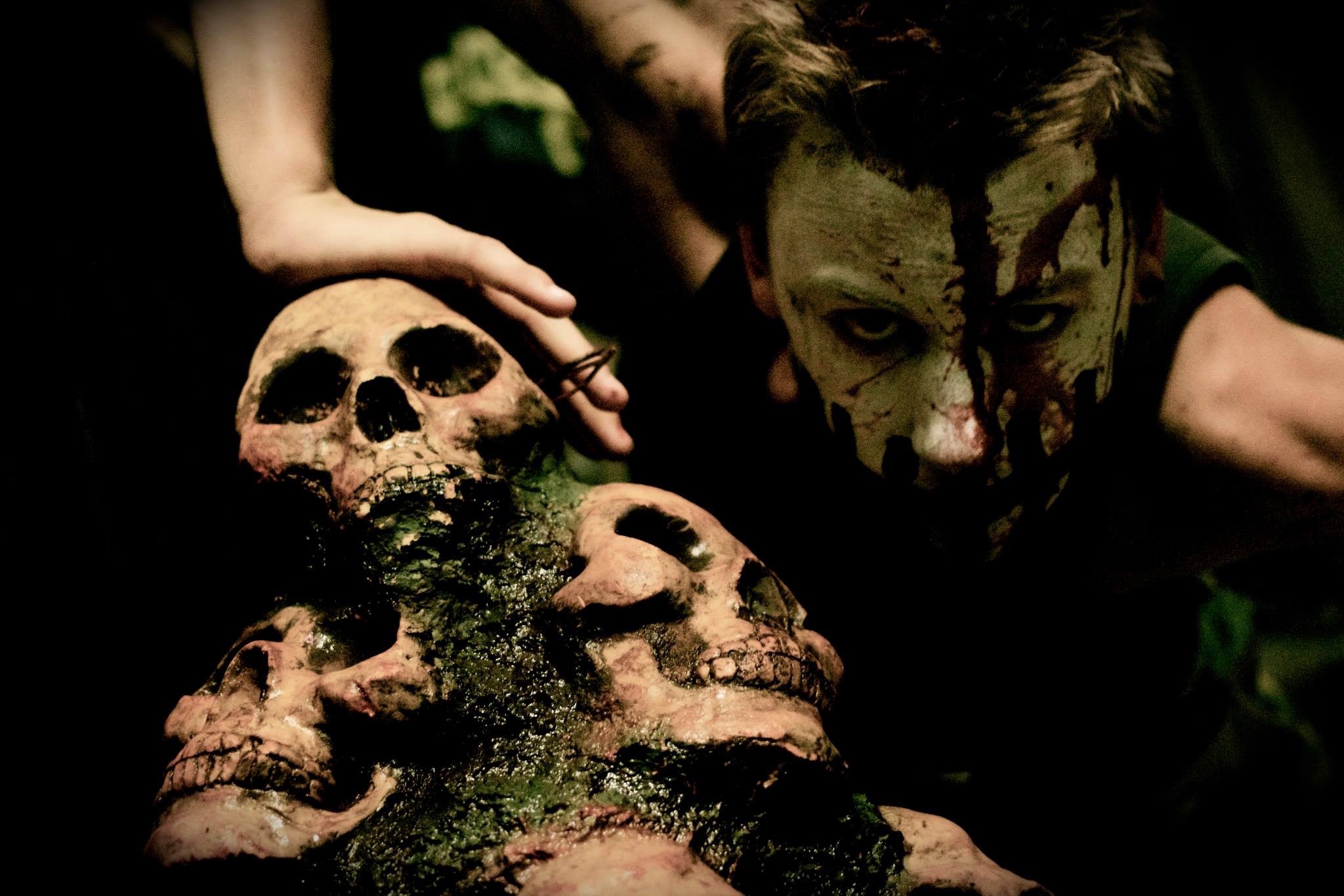 Jackson leaning on skulls