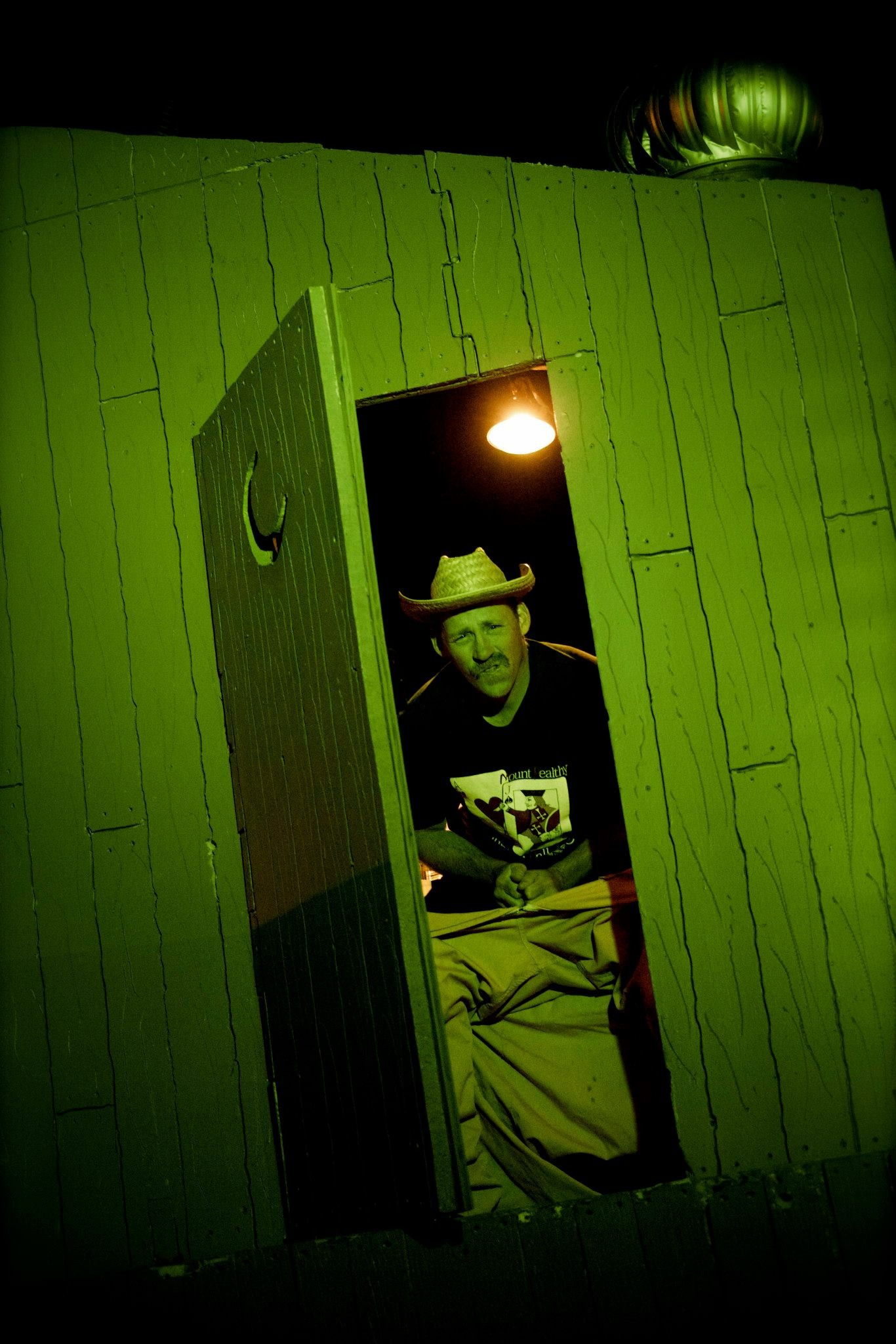 Matt sittin in outhouse
